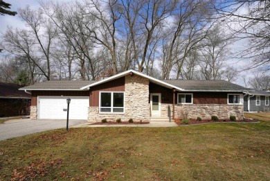 Welcome to this beautifully maintained ranch-style home situated on River Island Golf Course in Wisconsin - for sale on GolfHomes.com, golf home, golf lot