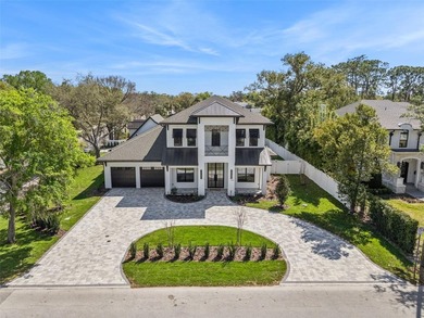 Step into this stunning West-Indies inspired luxury home crafted on Interlachen Country Club in Florida - for sale on GolfHomes.com, golf home, golf lot
