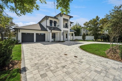Step into this stunning West-Indies inspired luxury home crafted on Interlachen Country Club in Florida - for sale on GolfHomes.com, golf home, golf lot