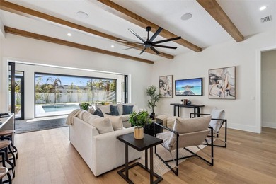 Step into this stunning West-Indies inspired luxury home crafted on Interlachen Country Club in Florida - for sale on GolfHomes.com, golf home, golf lot