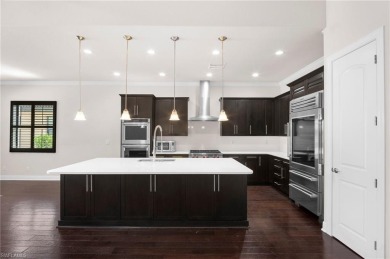 A Move-In-Ready Masterpiece with Stunning Water  Golf Views in on Spanish Wells Golf and Country Club in Florida - for sale on GolfHomes.com, golf home, golf lot