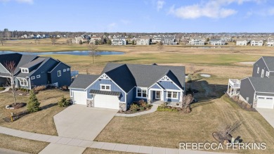 Stunning home overlooking the 15th green of Macatawa Legends on The Macatwa Legends Golf Course in Michigan - for sale on GolfHomes.com, golf home, golf lot