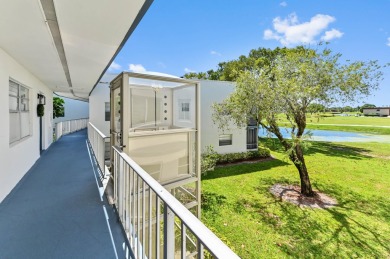 Enjoy breathtaking golf course and water views from this on Kings Point Golf -Flanders Way in Florida - for sale on GolfHomes.com, golf home, golf lot
