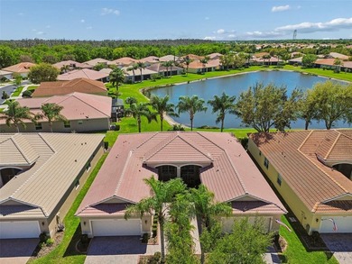 This lovely home is located just steps away from the Valencia on Caloosa Greens Executive Golf Course in Florida - for sale on GolfHomes.com, golf home, golf lot