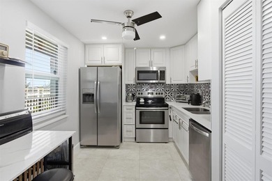 This spacious 3-bedroom, 2.5-bath corner unit in the gated *18th on Inverrary Country Club in Florida - for sale on GolfHomes.com, golf home, golf lot