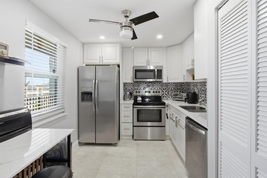 This spacious 3-bedroom, 2.5-bath corner unit in the gated *18th on Inverrary Country Club in Florida - for sale on GolfHomes.com, golf home, golf lot