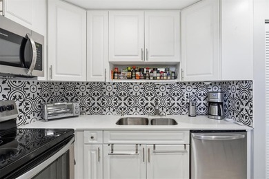 This spacious 3-bedroom, 2.5-bath corner unit in the gated *18th on Inverrary Country Club in Florida - for sale on GolfHomes.com, golf home, golf lot