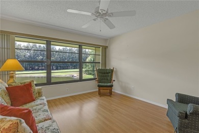 Come cozy up in this charming condo boasting picturesque lake on Vista Plantation Golf Club in Florida - for sale on GolfHomes.com, golf home, golf lot