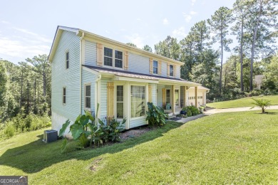 This beautifully updated home is located in a private gated on Canongate At Healy Point Country Club in Georgia - for sale on GolfHomes.com, golf home, golf lot