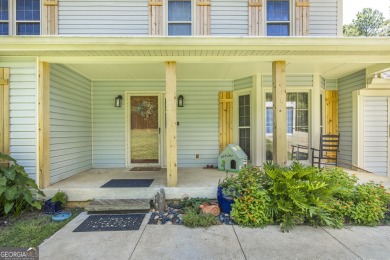 This beautifully updated home is located in a private gated on Canongate At Healy Point Country Club in Georgia - for sale on GolfHomes.com, golf home, golf lot