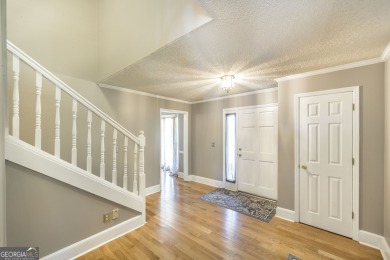 This beautifully updated home is located in a private gated on Canongate At Healy Point Country Club in Georgia - for sale on GolfHomes.com, golf home, golf lot