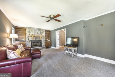 This beautifully updated home is located in a private gated on Canongate At Healy Point Country Club in Georgia - for sale on GolfHomes.com, golf home, golf lot