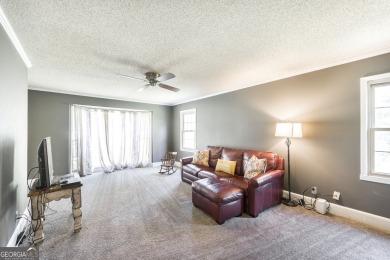 This beautifully updated home is located in a private gated on Canongate At Healy Point Country Club in Georgia - for sale on GolfHomes.com, golf home, golf lot