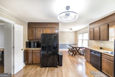 This beautifully updated home is located in a private gated on Canongate At Healy Point Country Club in Georgia - for sale on GolfHomes.com, golf home, golf lot