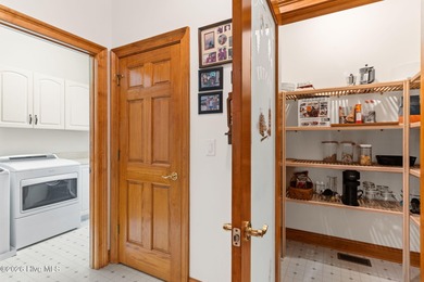 This custom 4-bedroom, 2.5-bath brick home is a true gem on Brunswick Plantation and Golf Resorts in North Carolina - for sale on GolfHomes.com, golf home, golf lot