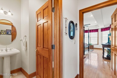 This custom 4-bedroom, 2.5-bath brick home is a true gem on Brunswick Plantation and Golf Resorts in North Carolina - for sale on GolfHomes.com, golf home, golf lot