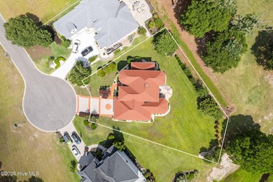 This custom 4-bedroom, 2.5-bath brick home is a true gem on Brunswick Plantation and Golf Resorts in North Carolina - for sale on GolfHomes.com, golf home, golf lot