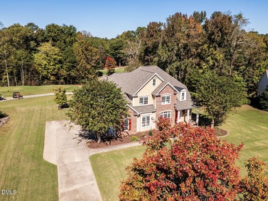 Custom-built home overlooking the 6th tee of Riverwood Golf on Riverwood Golf and Athletic Club in North Carolina - for sale on GolfHomes.com, golf home, golf lot