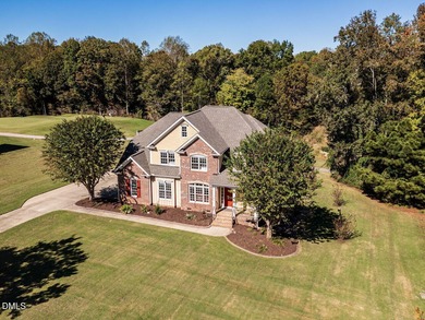 Custom-built home overlooking the 6th tee of Riverwood Golf on Riverwood Golf and Athletic Club in North Carolina - for sale on GolfHomes.com, golf home, golf lot
