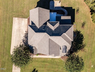 Custom-built home overlooking the 6th tee of Riverwood Golf on Riverwood Golf and Athletic Club in North Carolina - for sale on GolfHomes.com, golf home, golf lot