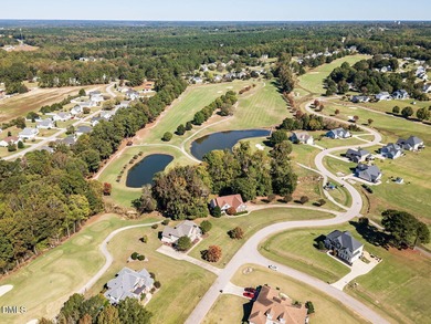 Custom-built home overlooking the 6th tee of Riverwood Golf on Riverwood Golf and Athletic Club in North Carolina - for sale on GolfHomes.com, golf home, golf lot