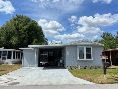 Nicely maintained furnished home on nice lot with no rear on Lake Henry Golf Club in Florida - for sale on GolfHomes.com, golf home, golf lot