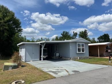 Nicely maintained furnished home on nice lot with no rear on Lake Henry Golf Club in Florida - for sale on GolfHomes.com, golf home, golf lot