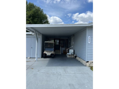 Nicely maintained furnished home on nice lot with no rear on Lake Henry Golf Club in Florida - for sale on GolfHomes.com, golf home, golf lot