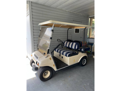 Nicely maintained furnished home on nice lot with no rear on Lake Henry Golf Club in Florida - for sale on GolfHomes.com, golf home, golf lot