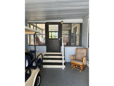 Nicely maintained furnished home on nice lot with no rear on Lake Henry Golf Club in Florida - for sale on GolfHomes.com, golf home, golf lot