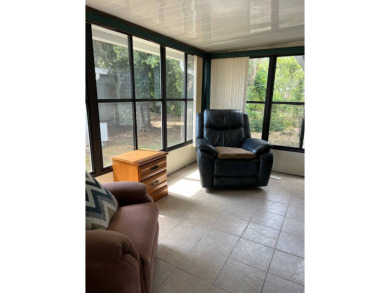 Nicely maintained furnished home on nice lot with no rear on Lake Henry Golf Club in Florida - for sale on GolfHomes.com, golf home, golf lot