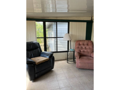 Nicely maintained furnished home on nice lot with no rear on Lake Henry Golf Club in Florida - for sale on GolfHomes.com, golf home, golf lot