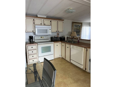 Nicely maintained furnished home on nice lot with no rear on Lake Henry Golf Club in Florida - for sale on GolfHomes.com, golf home, golf lot