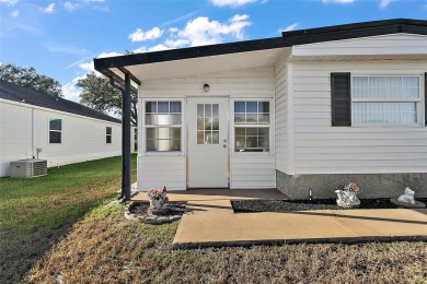 Welcome to this charming two-bedroom, one-bathroom home nestled on El Diablo Executive Golf Course in Florida - for sale on GolfHomes.com, golf home, golf lot