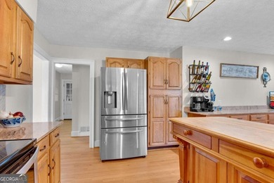 Welcome to this beautifully maintained 4-bedroom, 3-bath ranch on Bent Tree Golf Course in Georgia - for sale on GolfHomes.com, golf home, golf lot