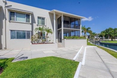 BEAUTIFULLY UPDATED FIRST FLOOR CORNER UNIT, PRIVATE & IDEALLY on BallenIsles Golf and Country Club in Florida - for sale on GolfHomes.com, golf home, golf lot