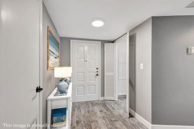 BEAUTIFULLY UPDATED FIRST FLOOR CORNER UNIT, PRIVATE & IDEALLY on BallenIsles Golf and Country Club in Florida - for sale on GolfHomes.com, golf home, golf lot