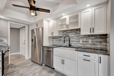 BEAUTIFULLY UPDATED FIRST FLOOR CORNER UNIT, PRIVATE & IDEALLY on BallenIsles Golf and Country Club in Florida - for sale on GolfHomes.com, golf home, golf lot