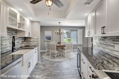 BEAUTIFULLY UPDATED FIRST FLOOR CORNER UNIT, PRIVATE & IDEALLY on BallenIsles Golf and Country Club in Florida - for sale on GolfHomes.com, golf home, golf lot