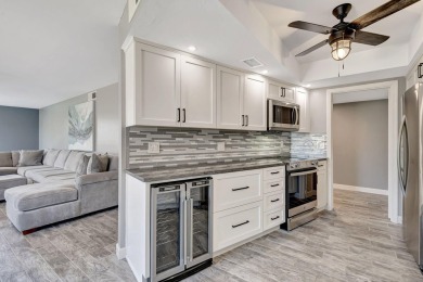BEAUTIFULLY UPDATED FIRST FLOOR CORNER UNIT, PRIVATE & IDEALLY on BallenIsles Golf and Country Club in Florida - for sale on GolfHomes.com, golf home, golf lot