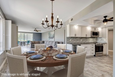 BEAUTIFULLY UPDATED FIRST FLOOR CORNER UNIT, PRIVATE & IDEALLY on BallenIsles Golf and Country Club in Florida - for sale on GolfHomes.com, golf home, golf lot