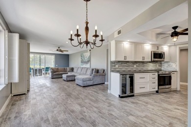 BEAUTIFULLY UPDATED FIRST FLOOR CORNER UNIT, PRIVATE & IDEALLY on BallenIsles Golf and Country Club in Florida - for sale on GolfHomes.com, golf home, golf lot