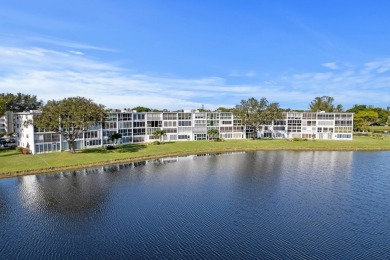 BEAUTIFUL WATERFRONT CONDO | MOVE-IN READY | HIGHLY DESIRABLE on Hillsboro Pines Golf in Florida - for sale on GolfHomes.com, golf home, golf lot