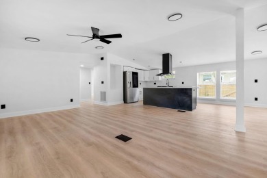 Step inside this beautifully reimagined manufactured home on Jake Gaither Golf Course in Florida - for sale on GolfHomes.com, golf home, golf lot