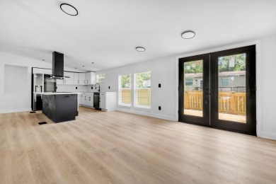 Step inside this beautifully reimagined manufactured home on Jake Gaither Golf Course in Florida - for sale on GolfHomes.com, golf home, golf lot