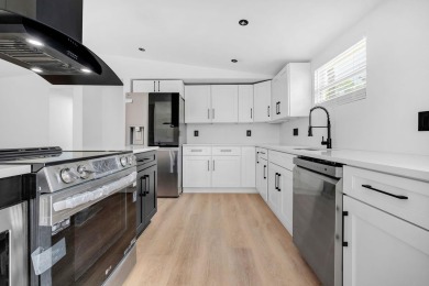 Step inside this beautifully reimagined manufactured home on Jake Gaither Golf Course in Florida - for sale on GolfHomes.com, golf home, golf lot