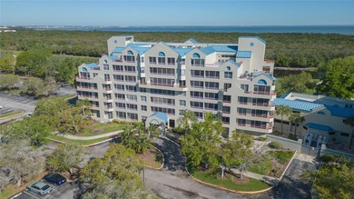 3rd floor 2-bedroom, 2 bath Crystal Bay condo overlooking the on Feather Sound Country Club in Florida - for sale on GolfHomes.com, golf home, golf lot