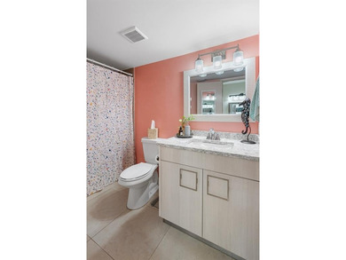 Step into Deer Creek's most sought-after villa--where modern on Deer Creek Golf Club in Florida - for sale on GolfHomes.com, golf home, golf lot