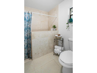 Step into Deer Creek's most sought-after villa--where modern on Deer Creek Golf Club in Florida - for sale on GolfHomes.com, golf home, golf lot