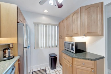 Welcome to this charming first-floor condo located in the on Fountains Golf and Country Club in Florida - for sale on GolfHomes.com, golf home, golf lot